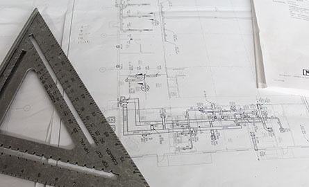 Image of blueprints and protractor