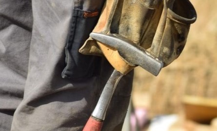 Construction Worker close up - hammer in belt loop