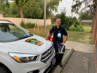 Kevin Paradis outside SNEMS SUV