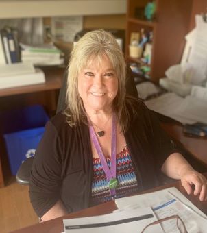 Lee Mesic at her desk