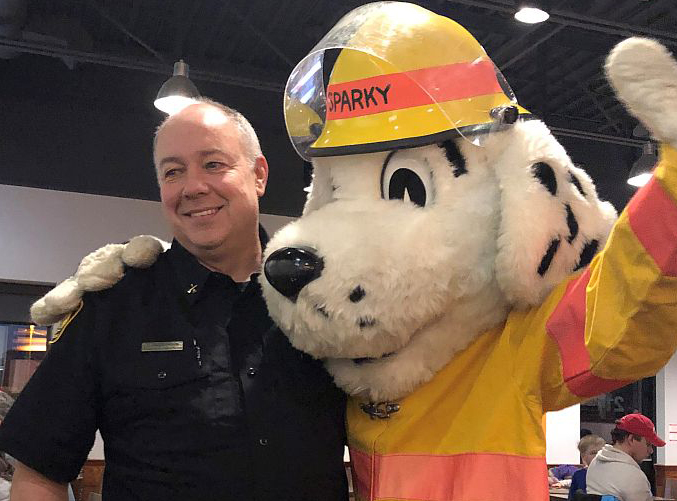 Dennis Brescacin of Thunder Bay Fire Rescue, and Sparky