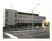 building with a lamp post and street out front