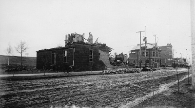 Two buildings with one burnt and only the bottom half remaining