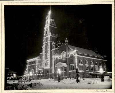 The Fort William Town Hall covered in Christmas lights at night