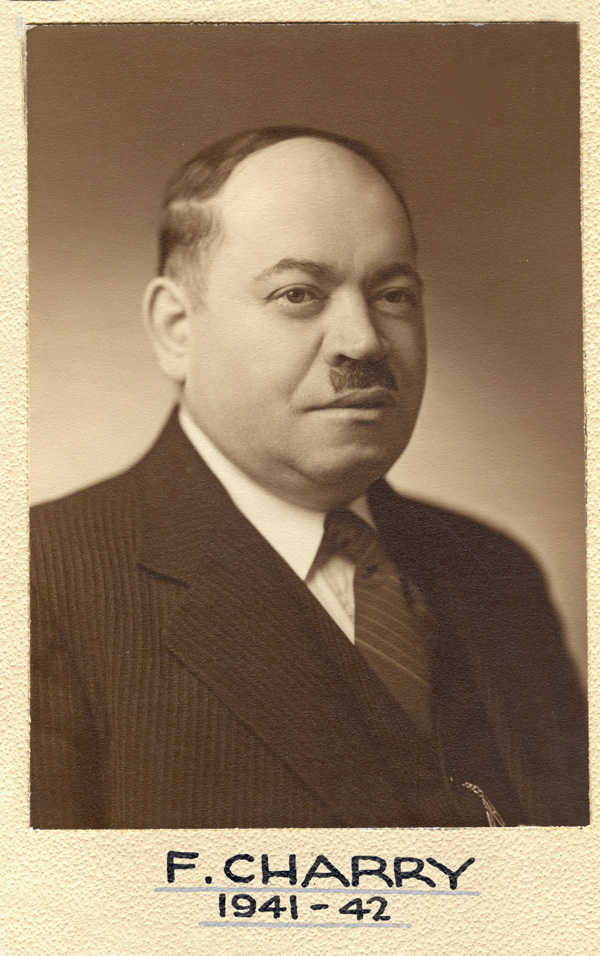 A black and white photo of Alderman Frank Charry in a suit