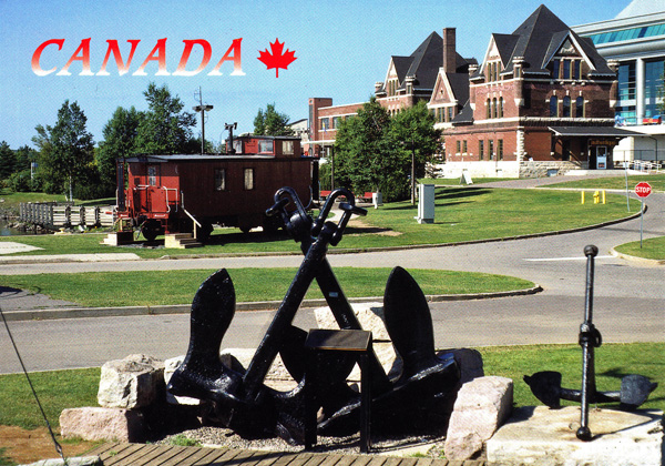A postcard with two anchors and a train caboose