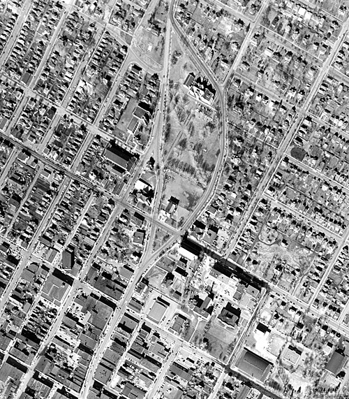 An aerial photograph taken over a body of water and residental houses