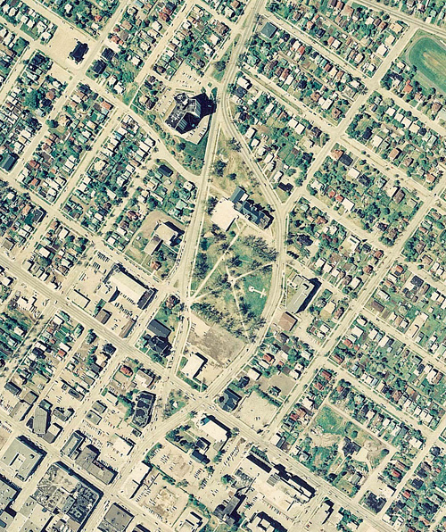 An aerial photograph taken over a body of water and residental houses