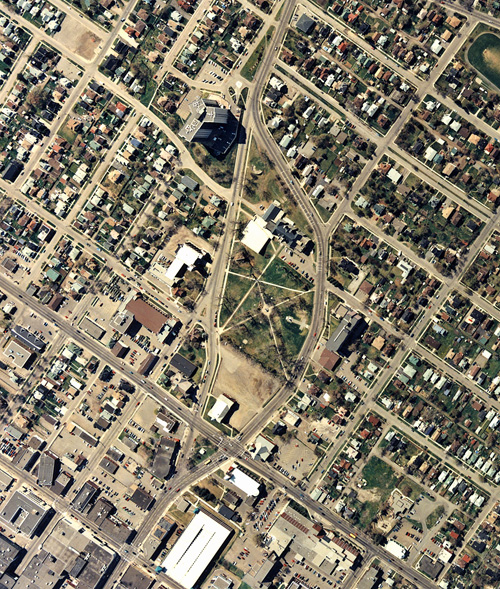 An aerial photogrpah is taken over a body of water and residental houses