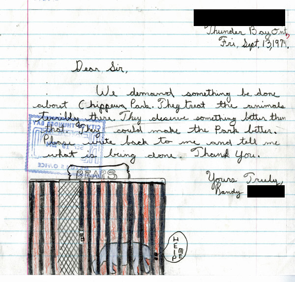 A handwritten letter with a picture of a bear drawn beside an enclosure