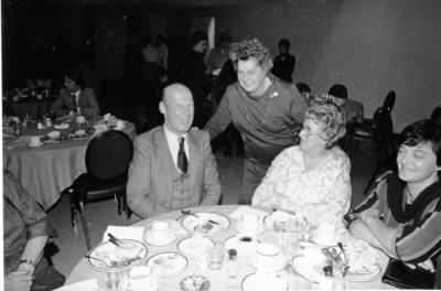 Betty Kennedy with people seated at a banquet table