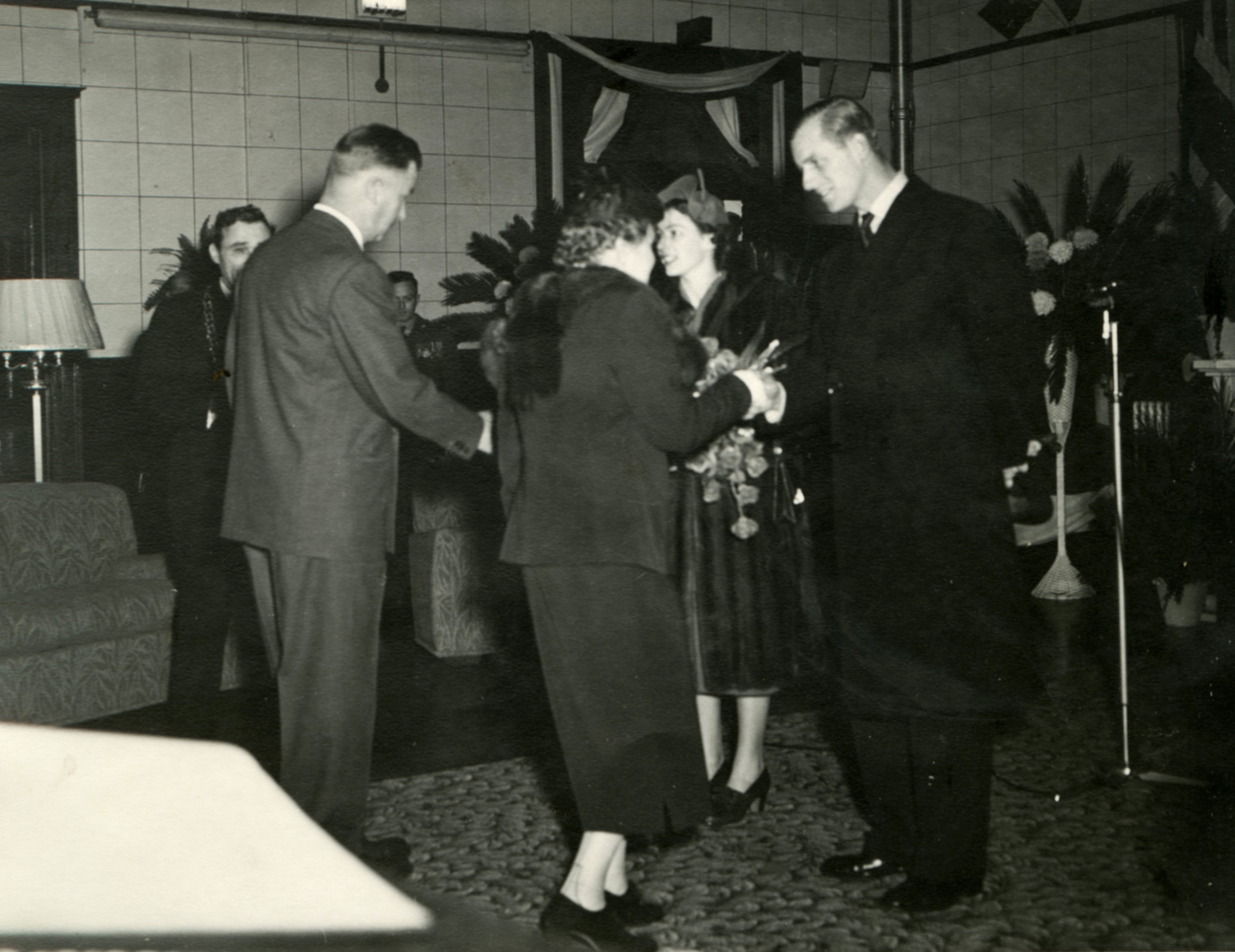 Dorothy Mary Pickup shaking hands with Princess and Prince