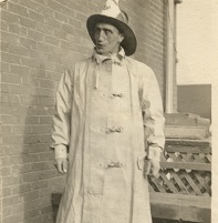 A man dressed in a firefighters uniform with hat