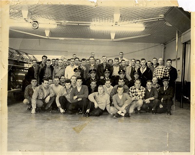 A group of firefighters standing and sitting together