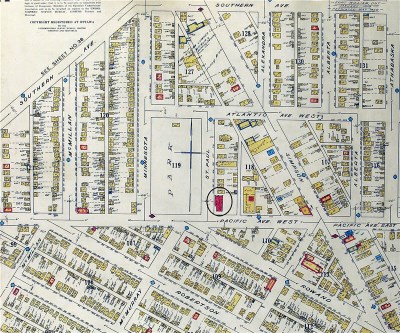 A handdrawn and coloured street map showing roads and buildings