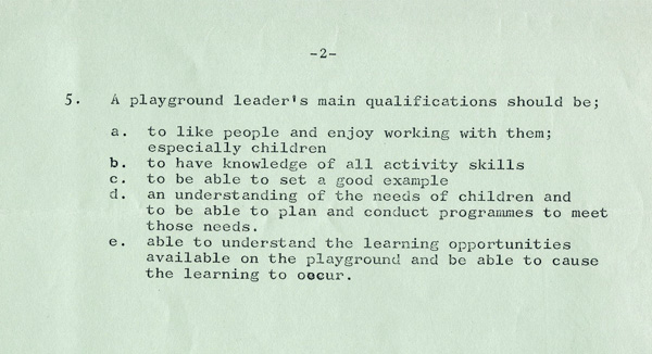 A green paper with typed writing 