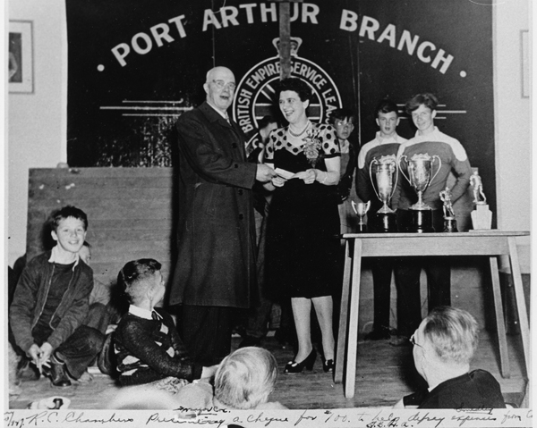 R.C. Chambers presenting a cheque to Hilda Donati
