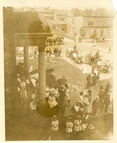 A group of people waiting outside the second Fort William City Hall