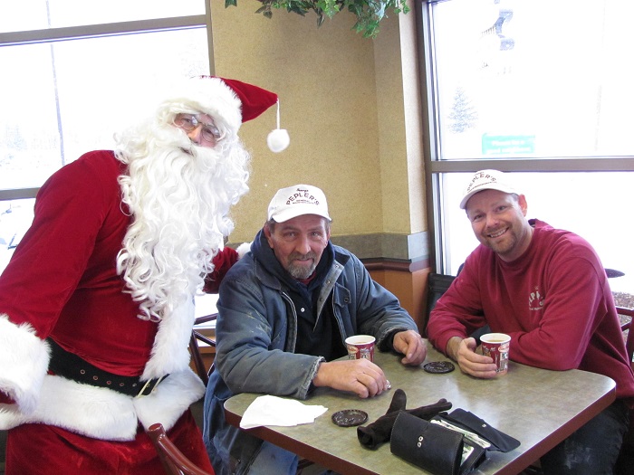 Santa and two Thunder Bayites enjoying their cups of coffee