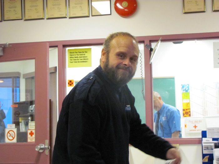 A man turning towards the camera and smiling