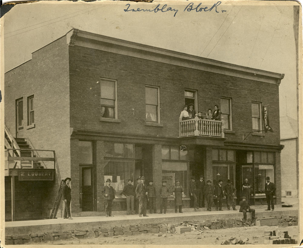 building, people on balcony and street
