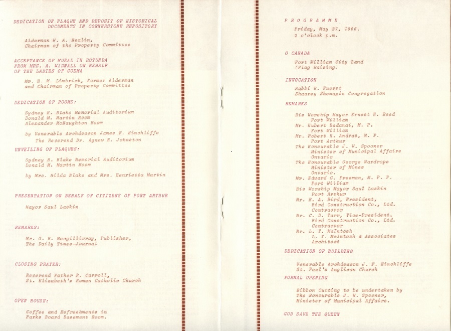 Two white pages opened from a booklet have red writing 