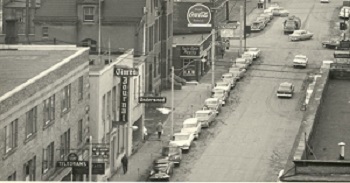 May street with cars parked alongside