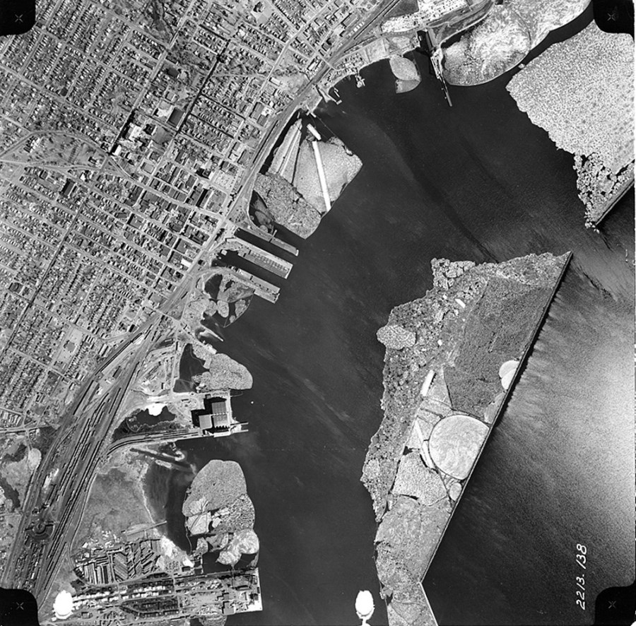 An aerial photograph depicting the waterfront in black and white