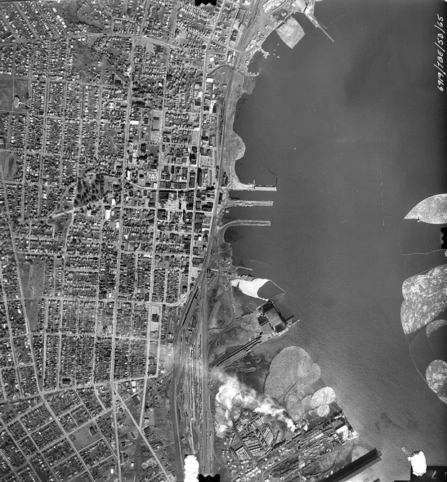 An aerial photograph of the Fort Willian waterfront in black and white