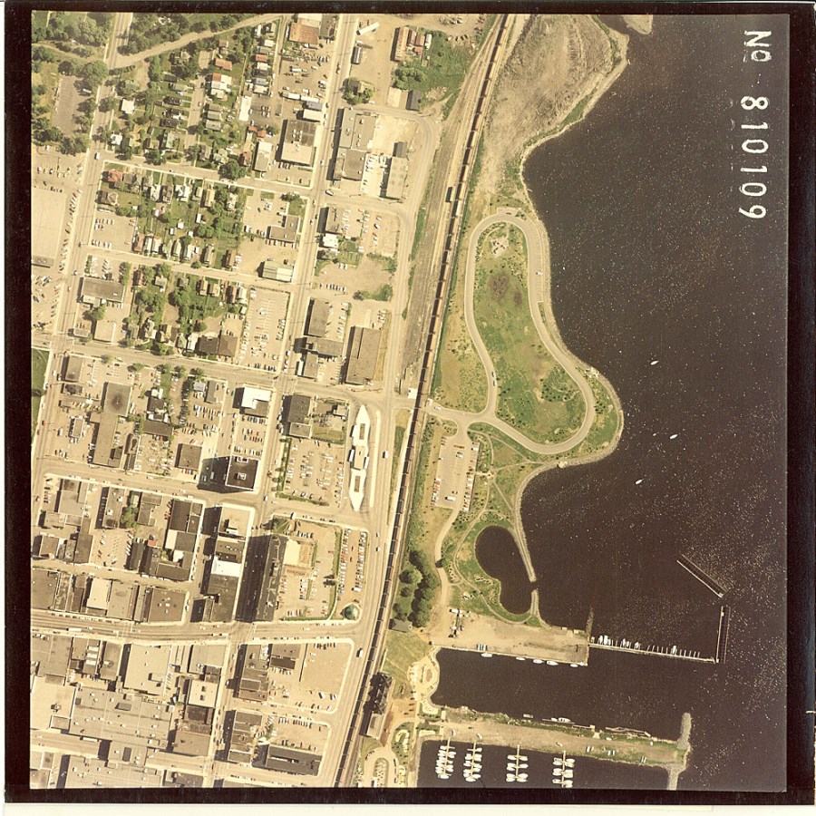 A coloured aerial photo of the waterfront and surrounding residental area