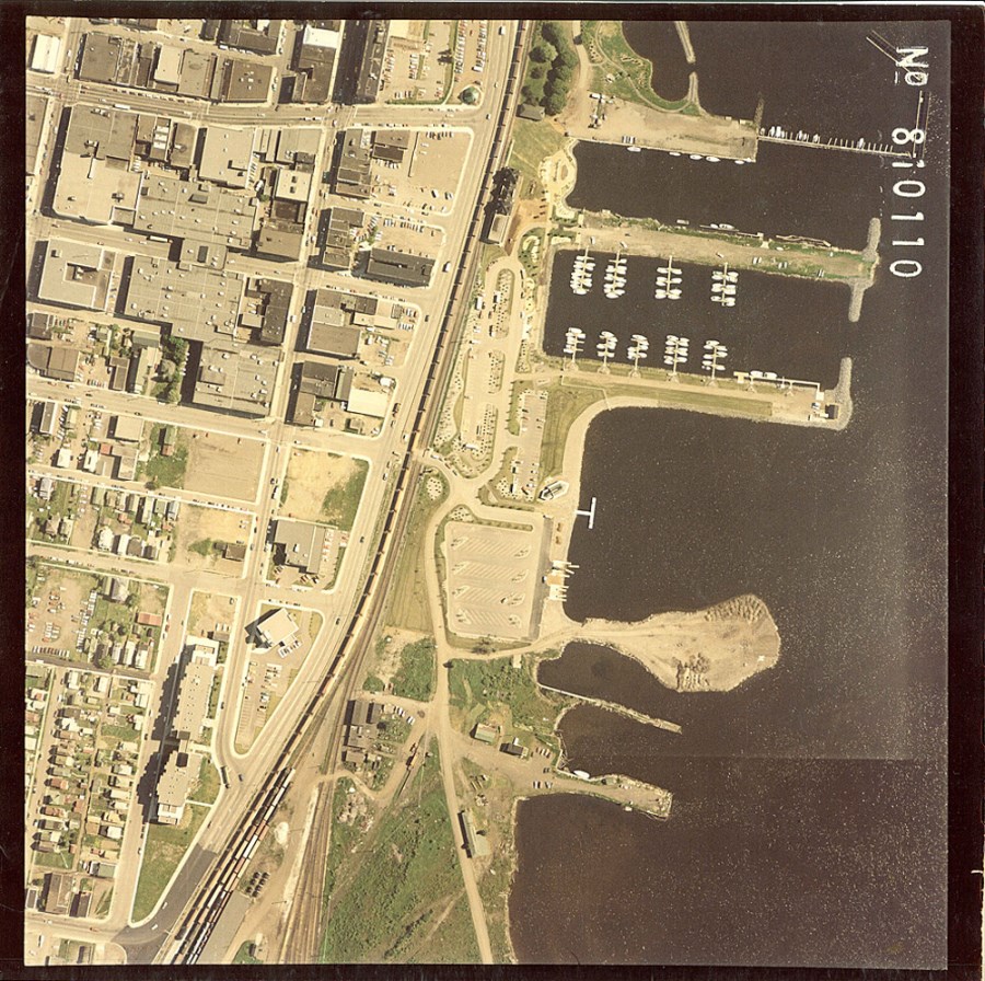 A coloured aerial photo of the waterfront and surrounding residental area