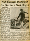 A newspaper clipping showing a woman on the waterfront