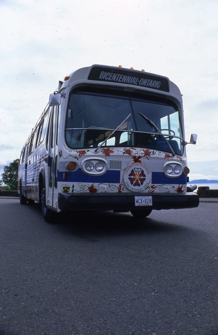 bus with various paintings on it. The front of the bus says, "Bicentennial-Ontario"