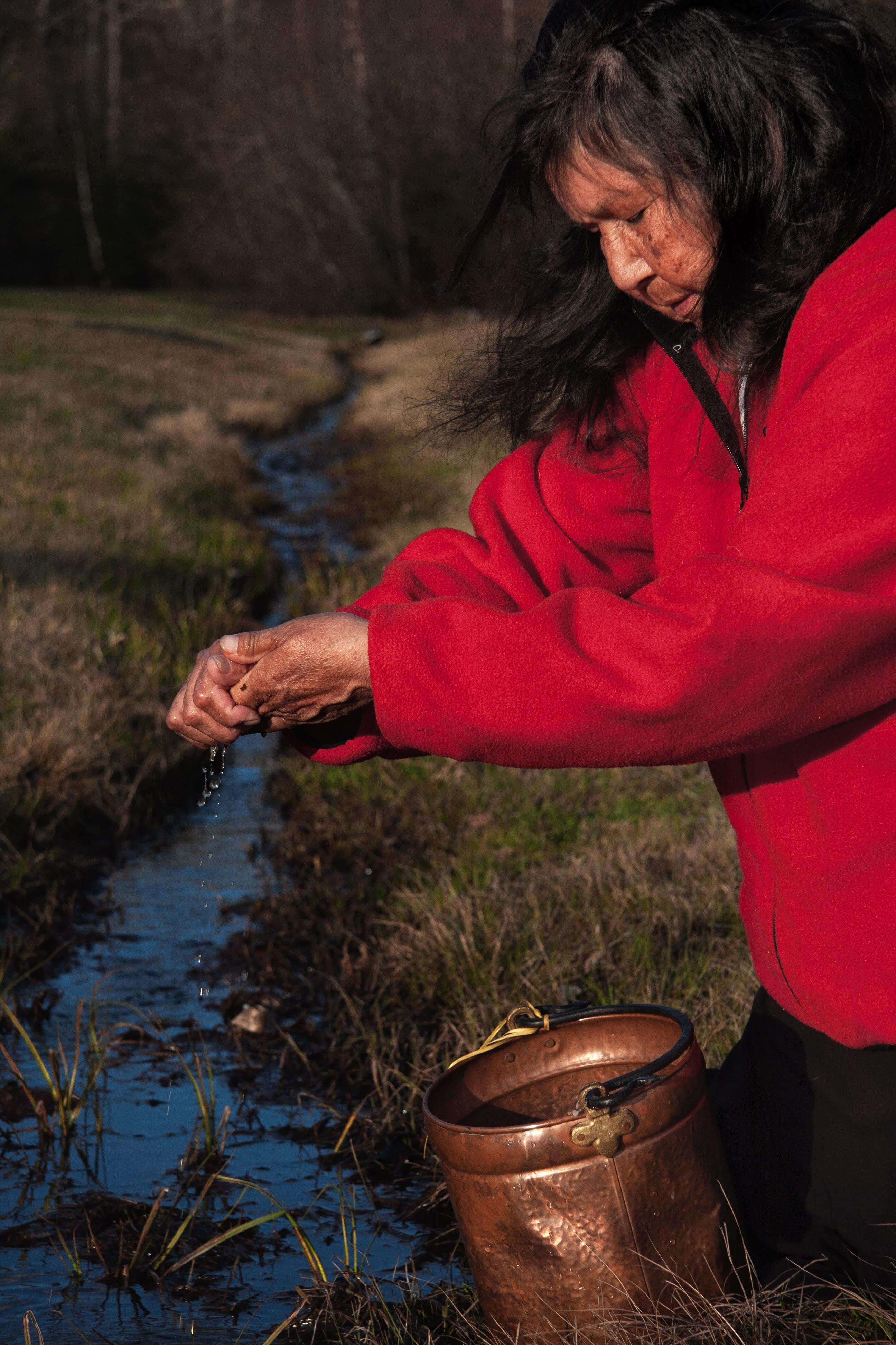 Josephine Mandamin over a water container