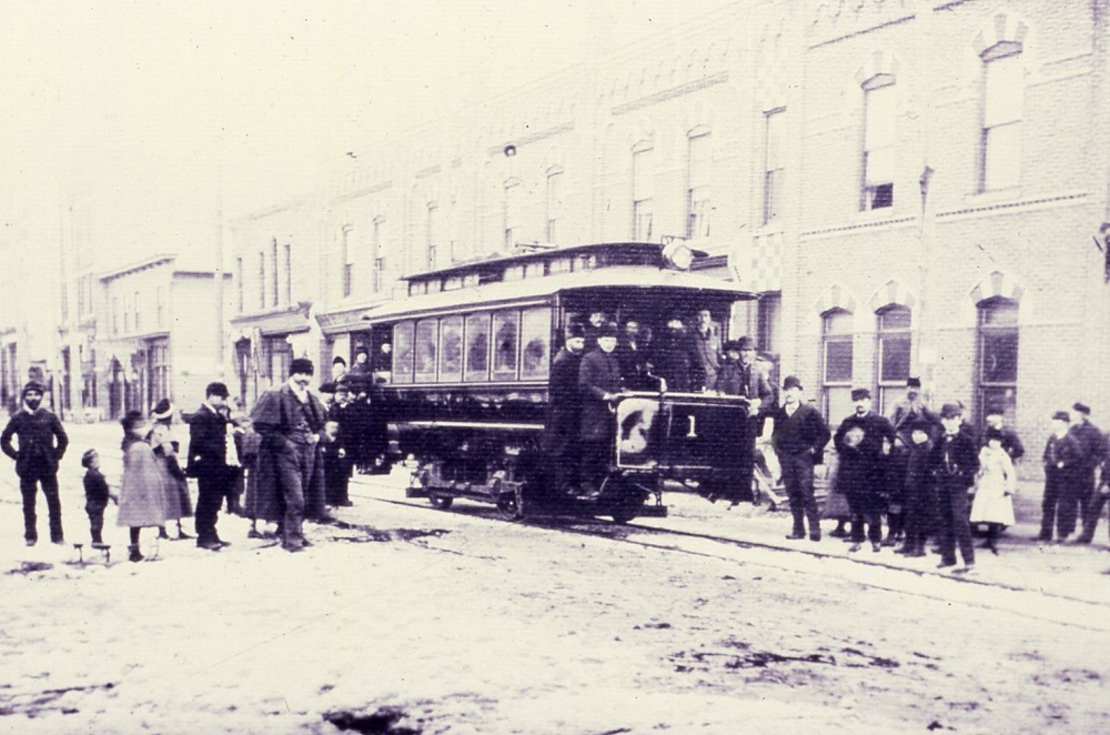 a group of people posing with the No.1 streetcar