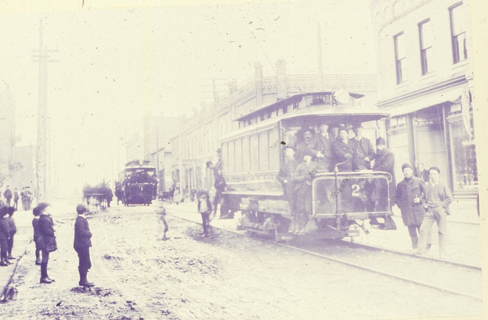 a group of men posing on the No.2 car