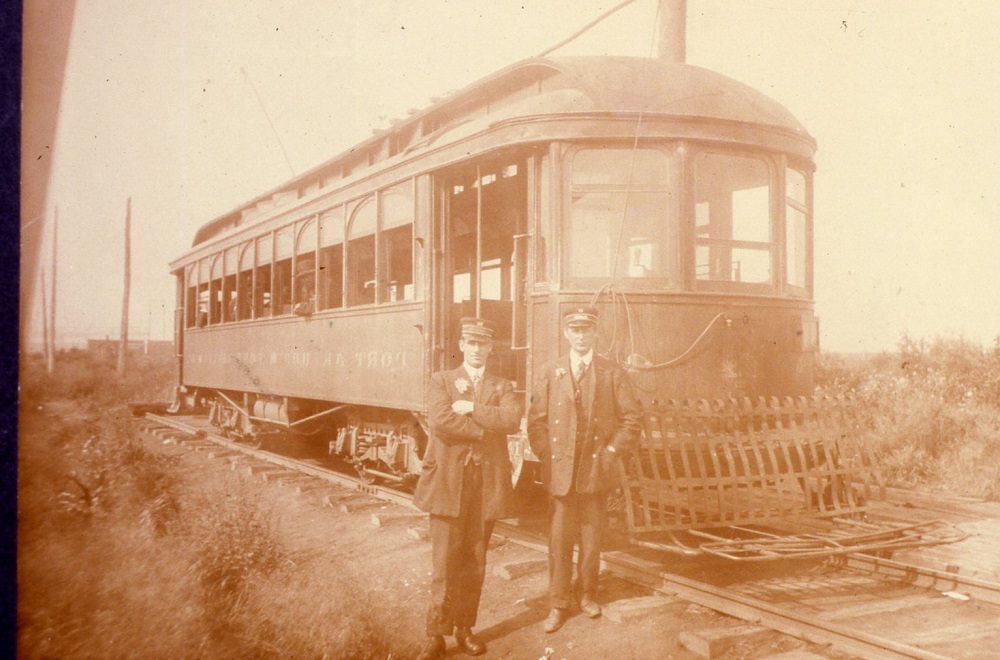 a streecar with its operator and motorman