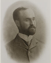 Mayor C. W. Jarvis sitting for a photograph in a black suit