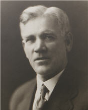 Mayor M. Edmeston sitting for a black and white photo wearing a suit
