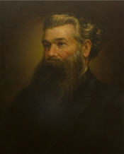 Mayor John McKellar with short grey hair, a long bushy black beard