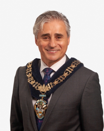Mayor Bill Mauro wearing a large necklace