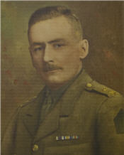 Mayor Milton Francis sits wearing a military unifrom and has a trim moustache