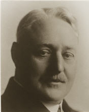 Mayor S. C. Young sitting wearing a black suit