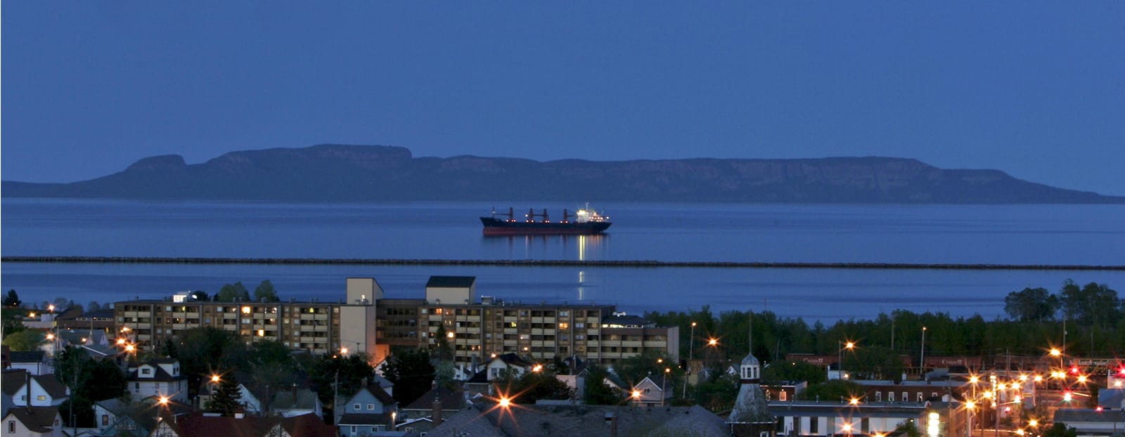 night view of city on lake