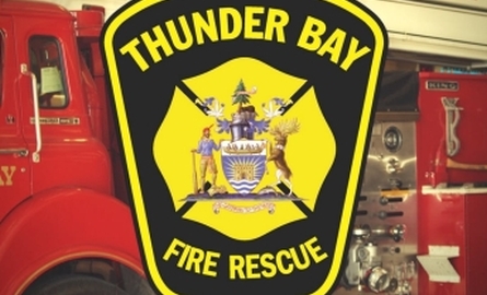 Thunder Bay Fire Rescue Logo in front of fire truck