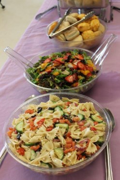 three bowls of food with serving utensils