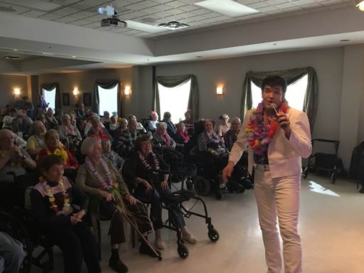 concert performance by man dressed as Elvis