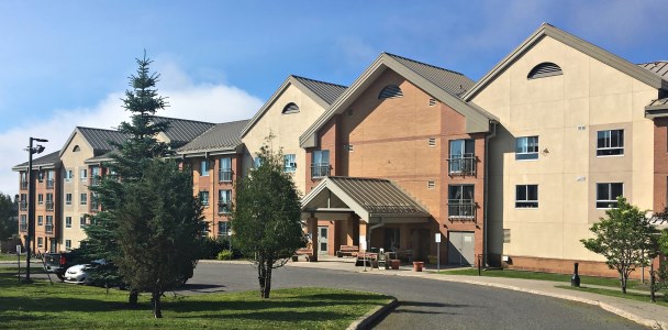 Jasper Place from outside with trees in front