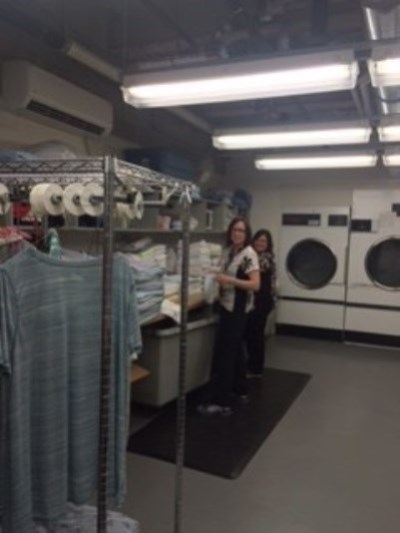 two people in a laundry room
