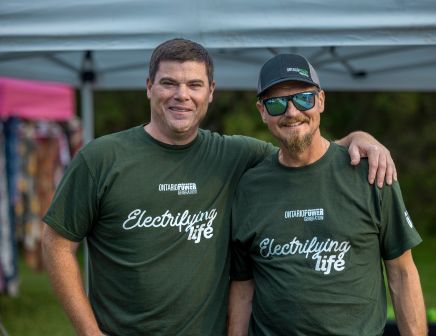 Two friends with matching green t-shirts